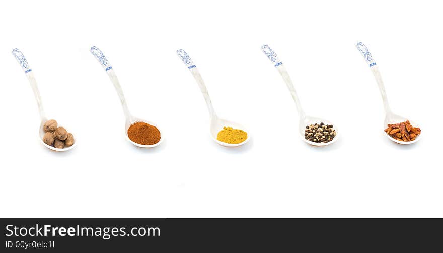 Oriental spices on chinese spon over white background