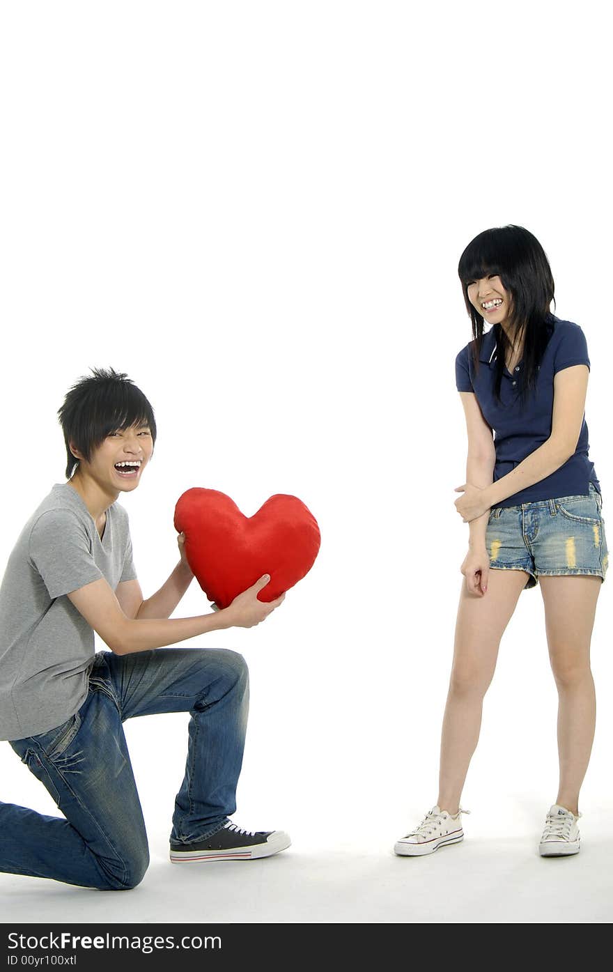 Young happy couple on white background