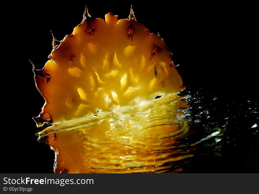 Pinneapple on a mirrow with water