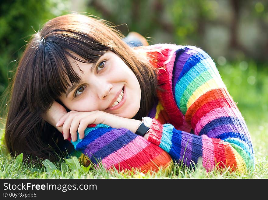 Beautiful girl relaxing on the lawn. Beautiful girl relaxing on the lawn