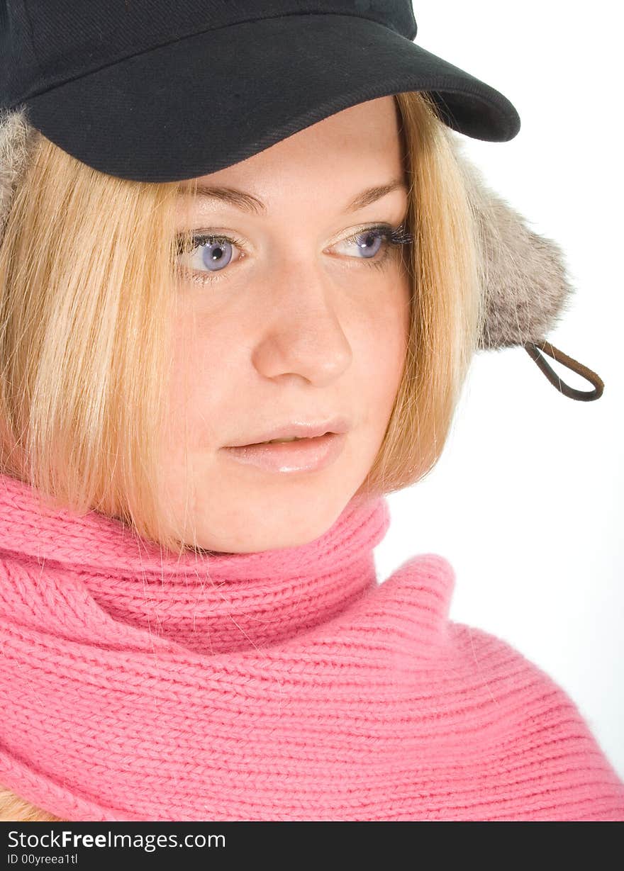 Blue-eyed blonde in fur cap and  pink scarf