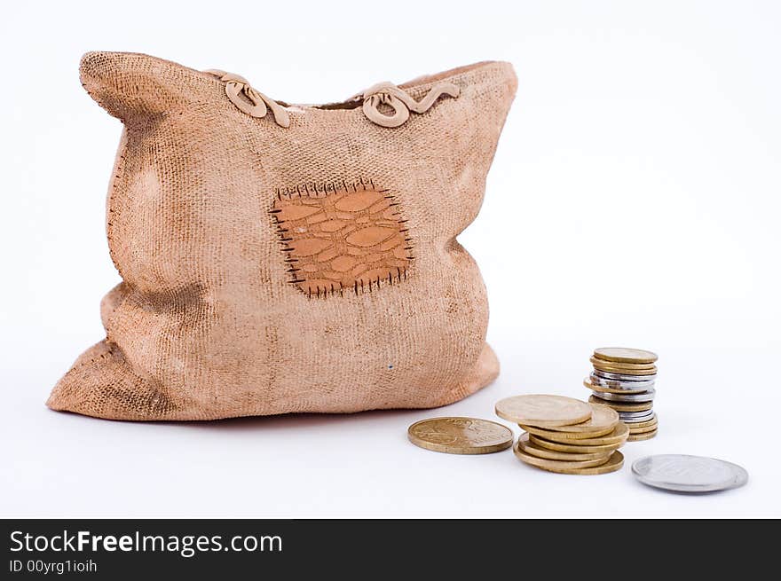 A piggy bank and some coins type from below