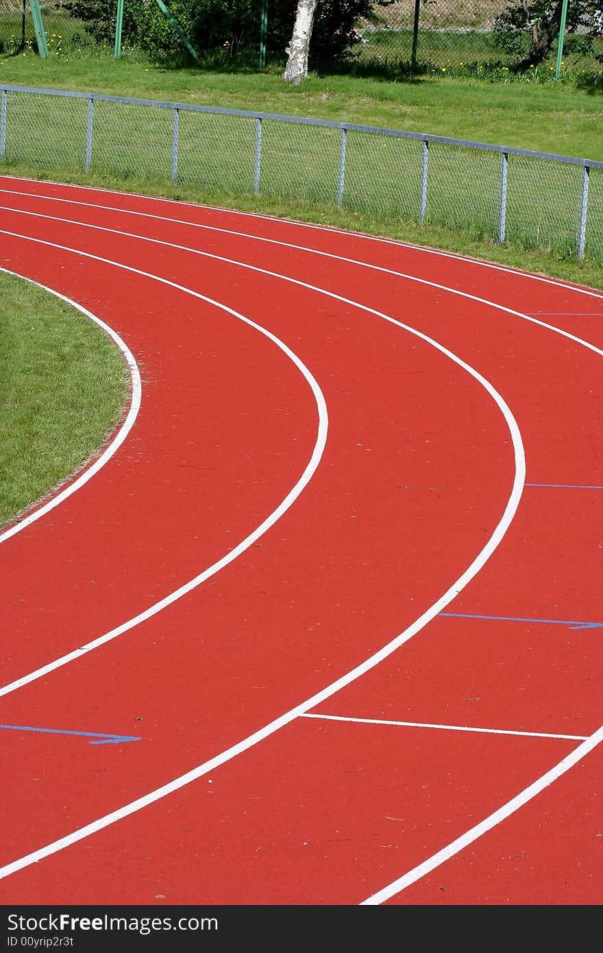 An outdoor running track with four lanes