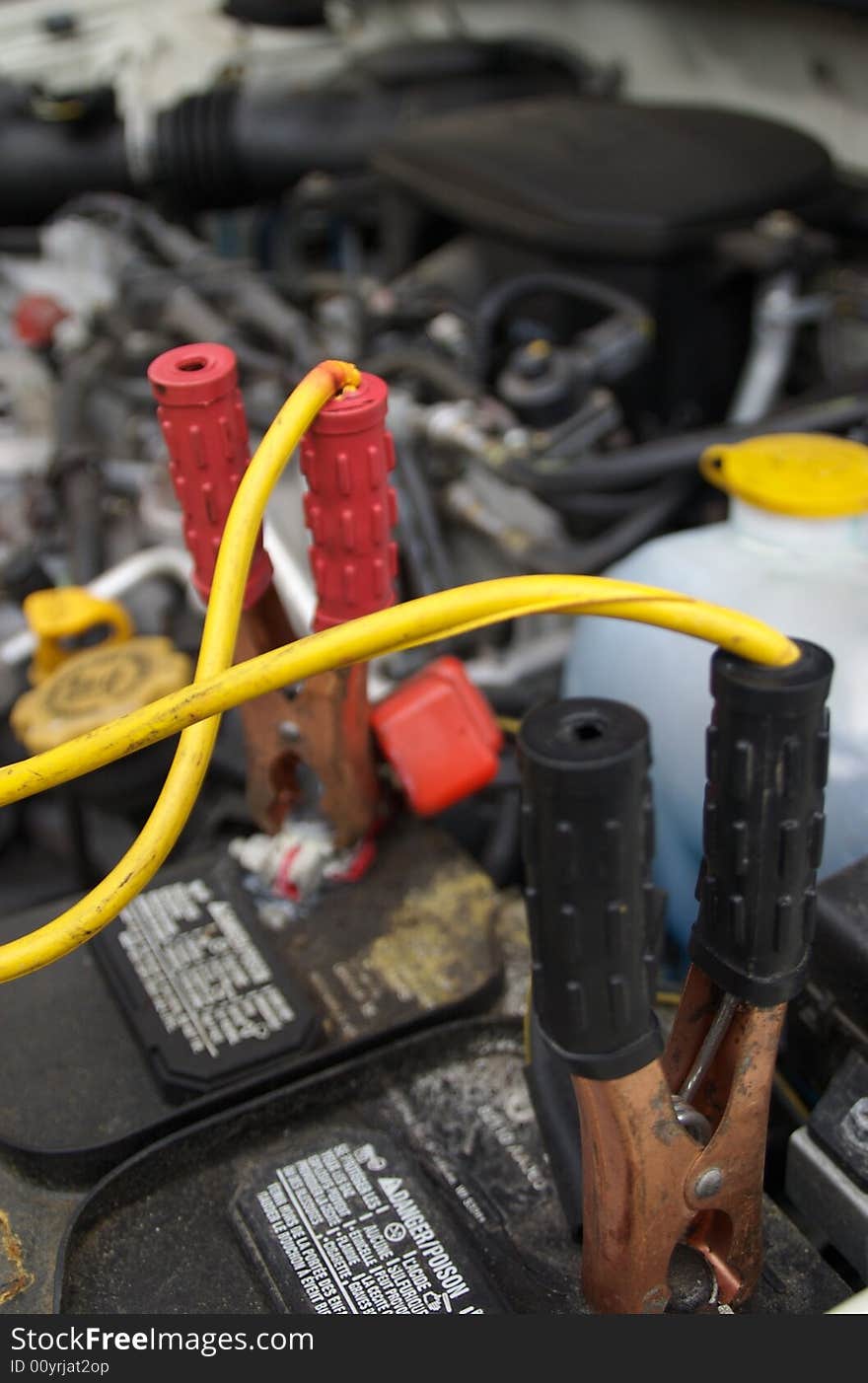 Jumper cables attached to a car battery