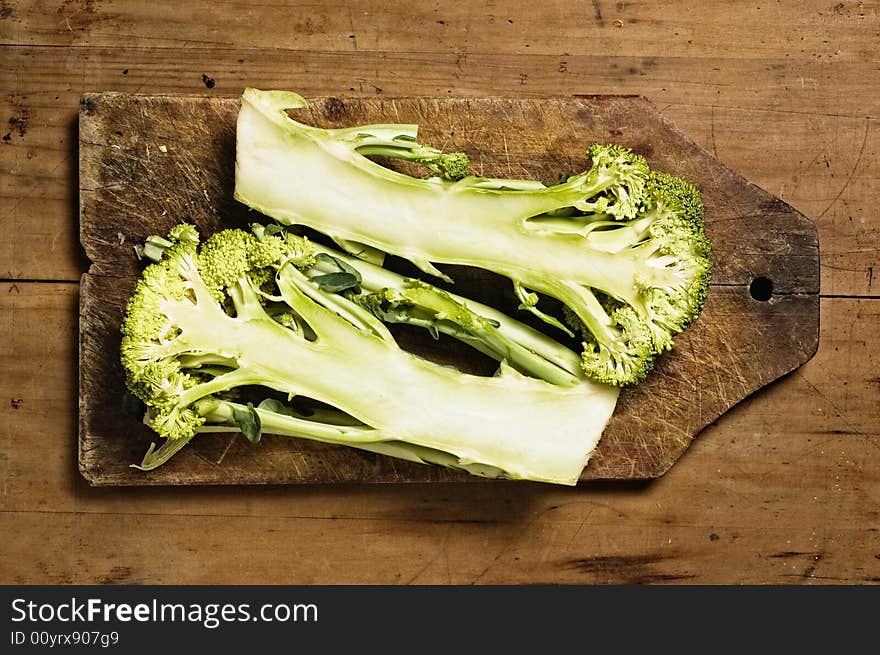 Cut brocoli on old cutting wooden table. Cut brocoli on old cutting wooden table.