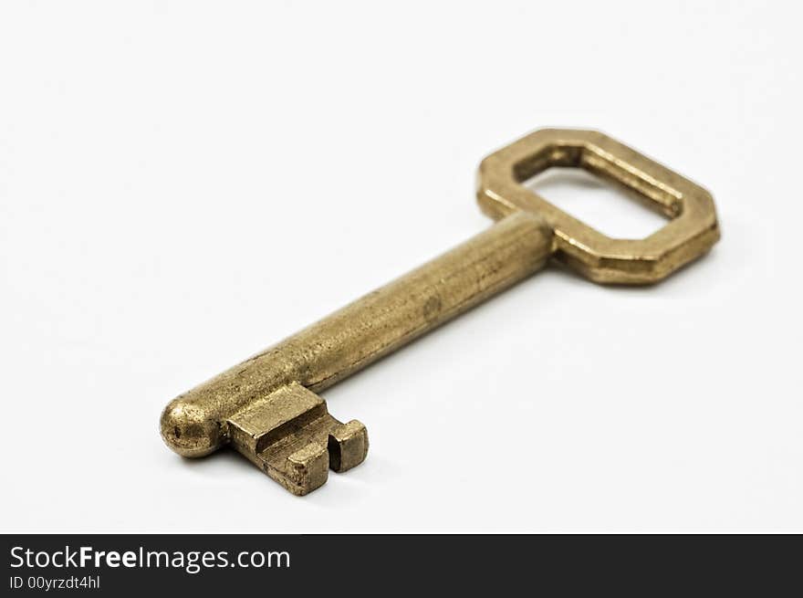 Vintage key on white background.