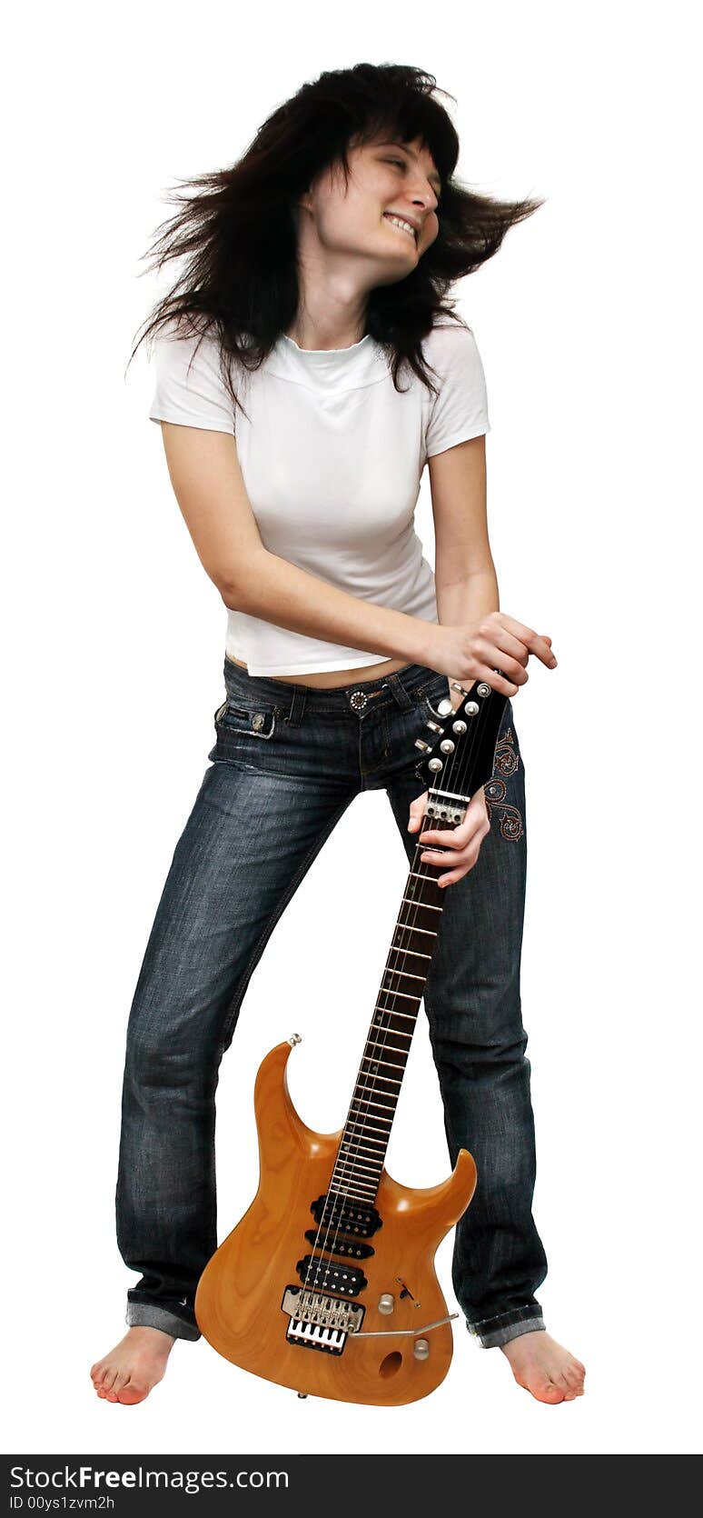 Pretty girl shaking her head holding an electric guitar