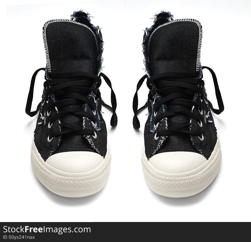 Pair of vintage styled sneakers isolated on white background