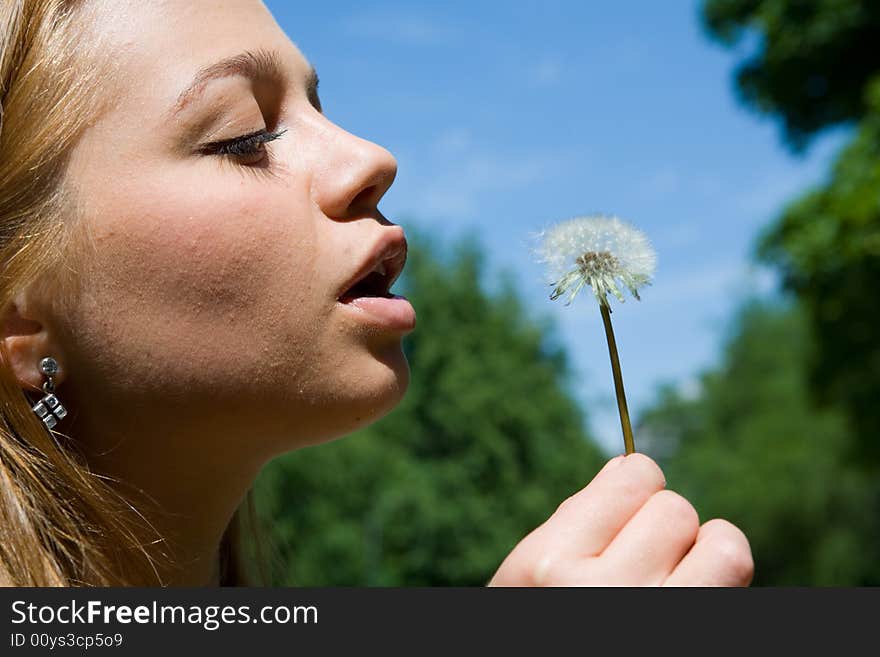 Girl and dandelion