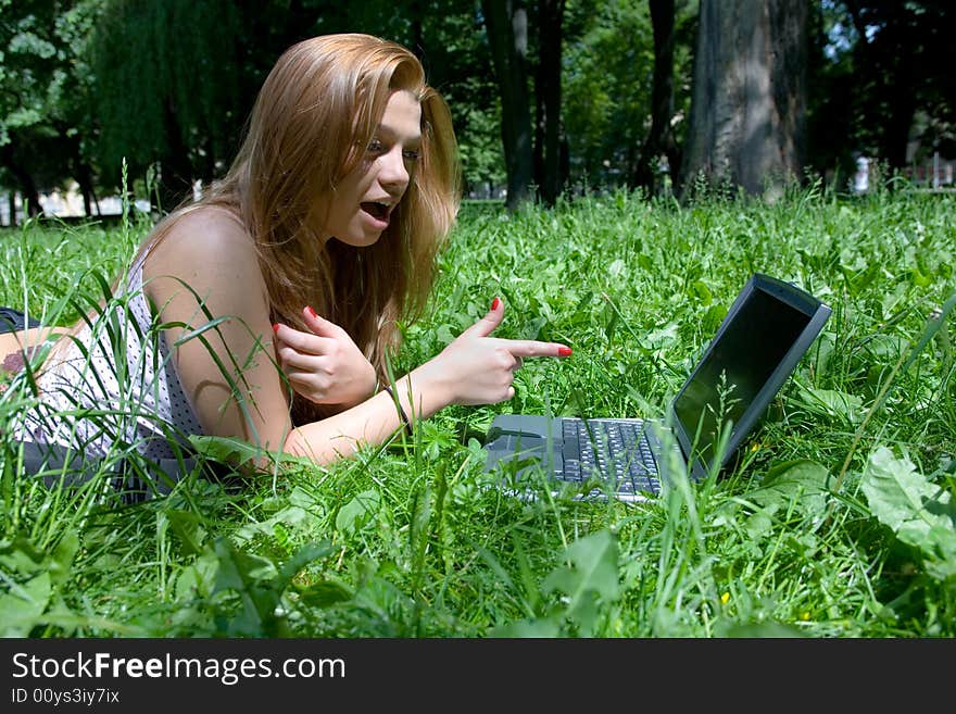 Portrait of  beautiful young girl with laptop