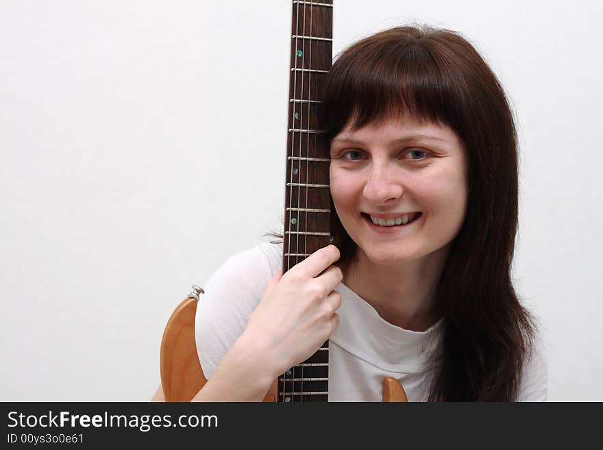 Pretty girl holding a guitar