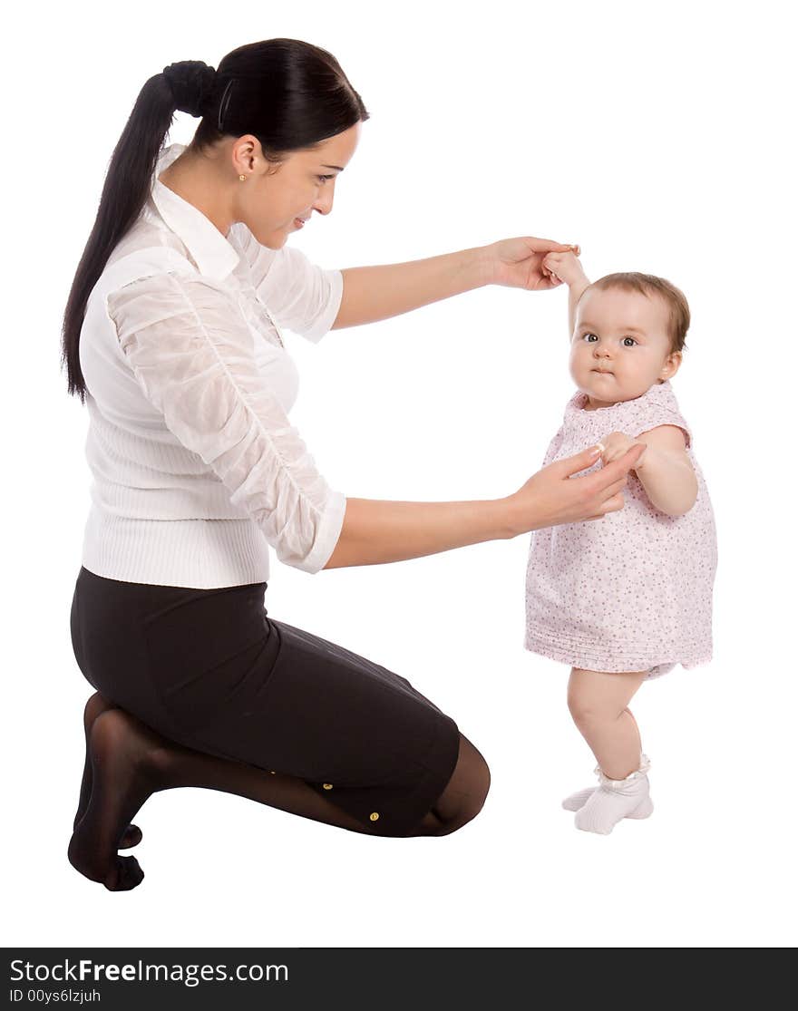 A mother teaches his daughter to walk