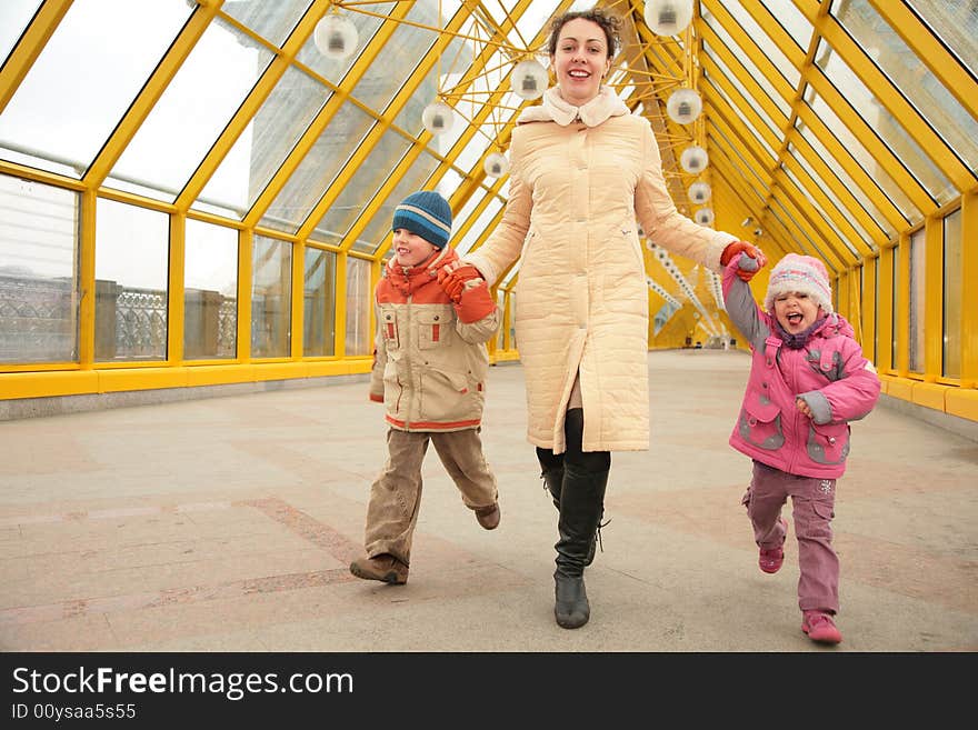 Mother with children on footbridge