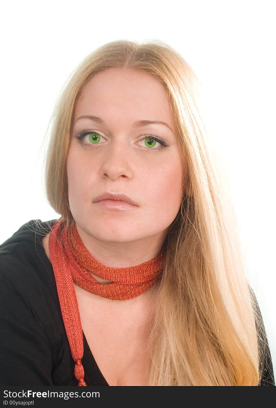 Portrait of sad green-eyed blonde in black on white background