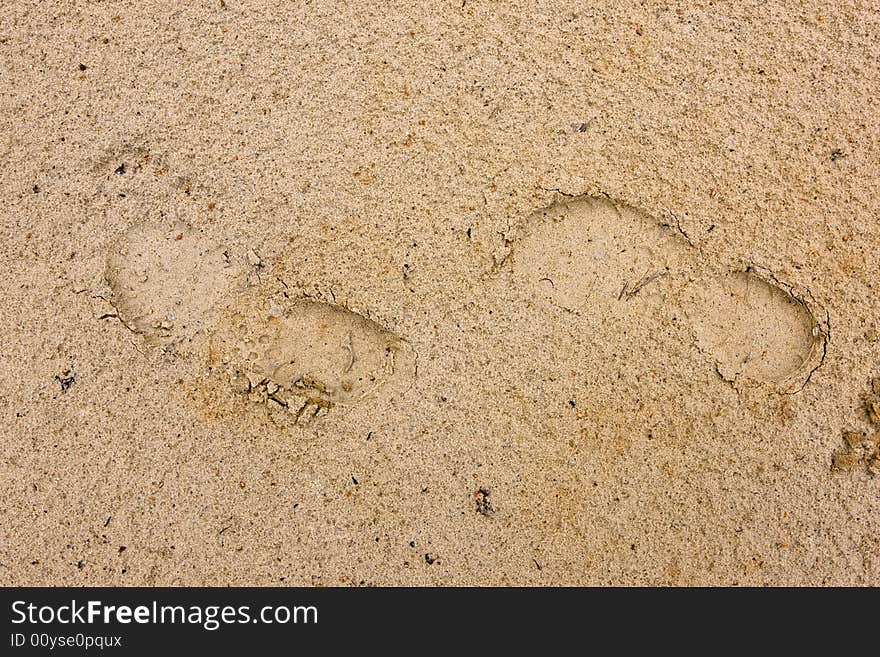 Footprints going over a sand