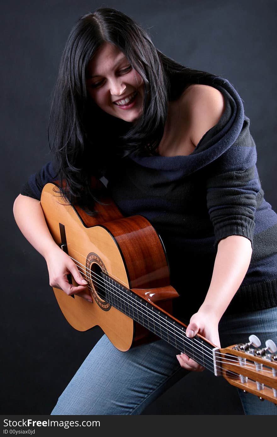 Photo of attractive brunette with guitar. Photo of attractive brunette with guitar