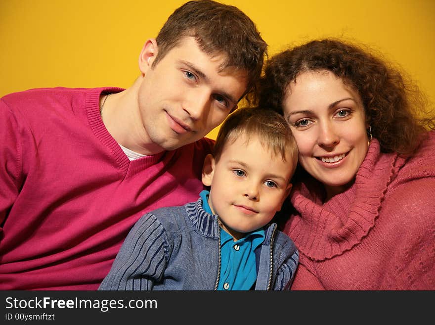 Family on a yellow background