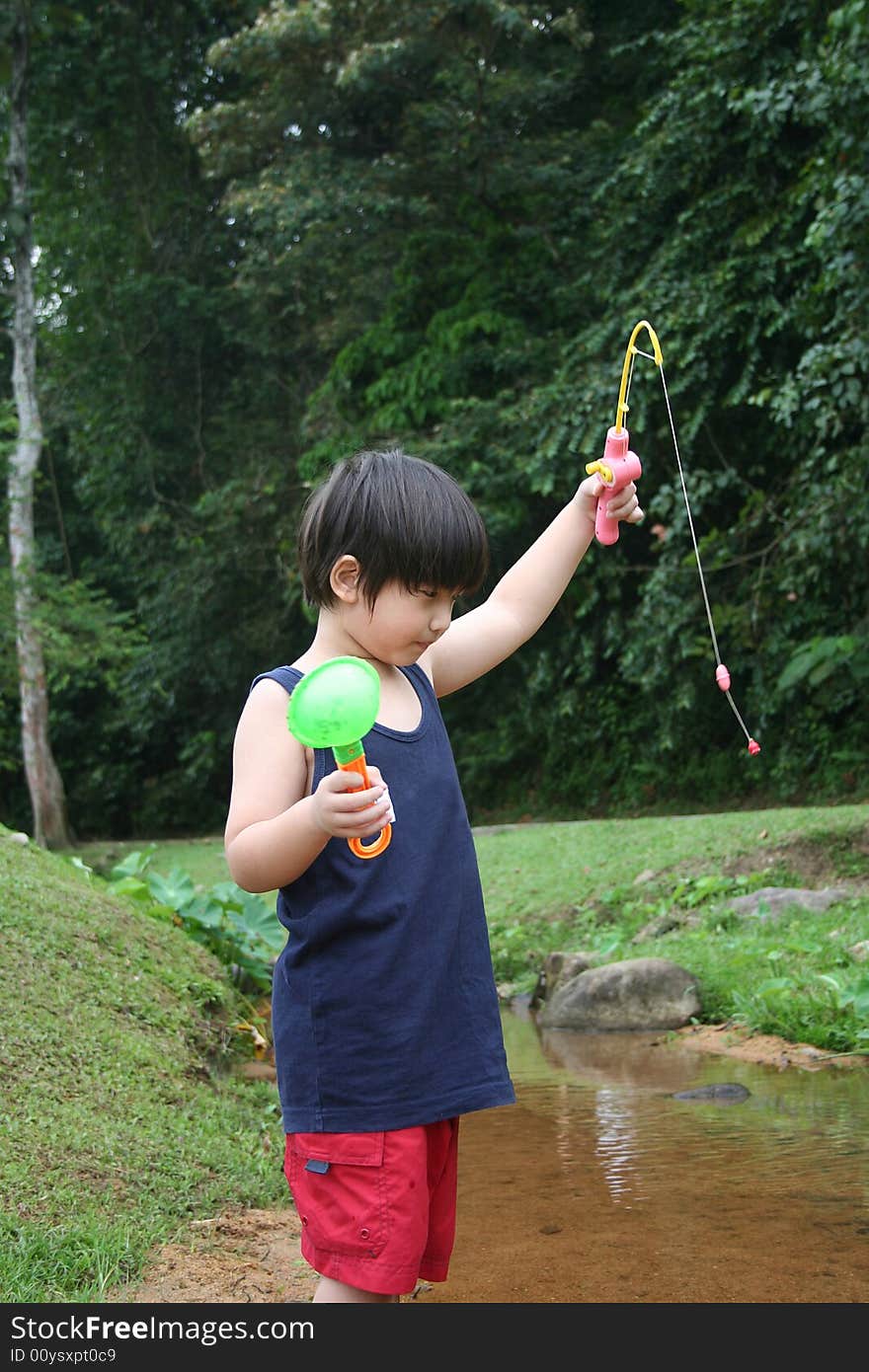 Boy catching fish