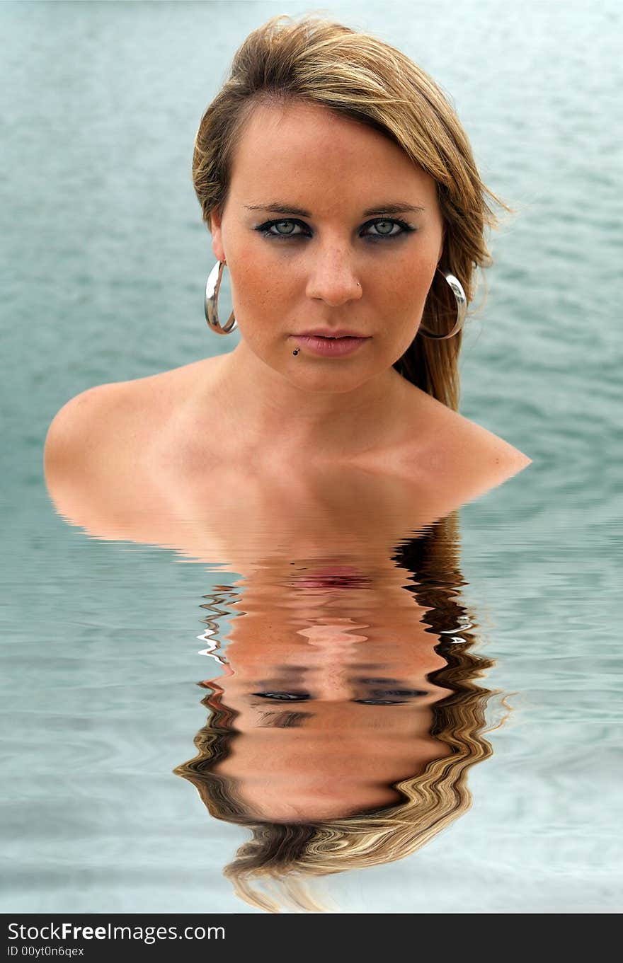 Beautiful woman reflected in water. Beautiful woman reflected in water