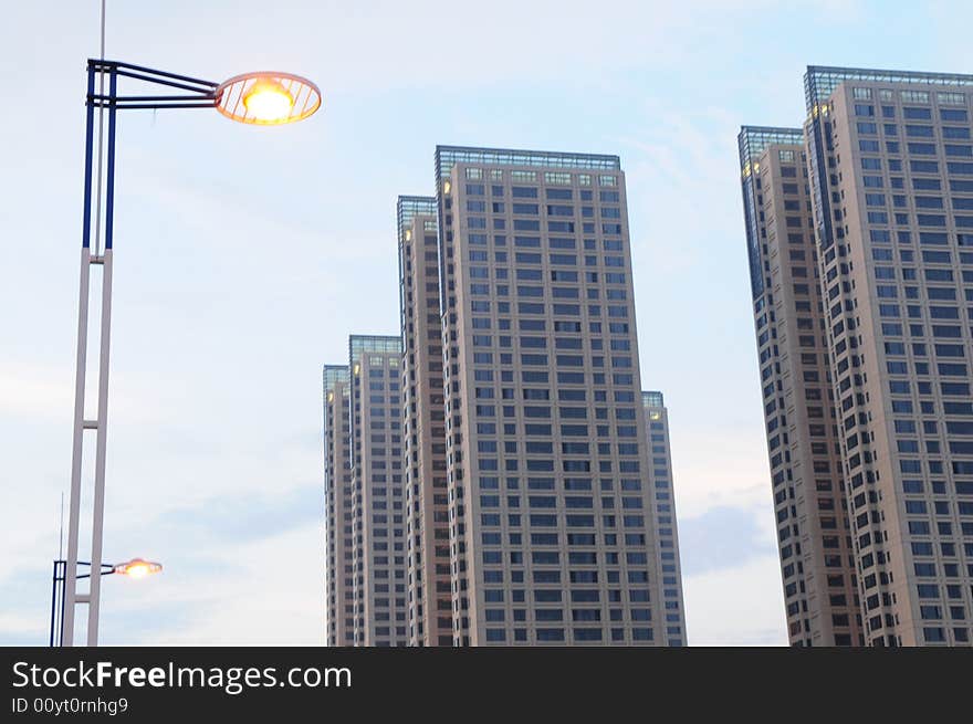 The street lamp and high rise office edifice. The street lamp and high rise office edifice.