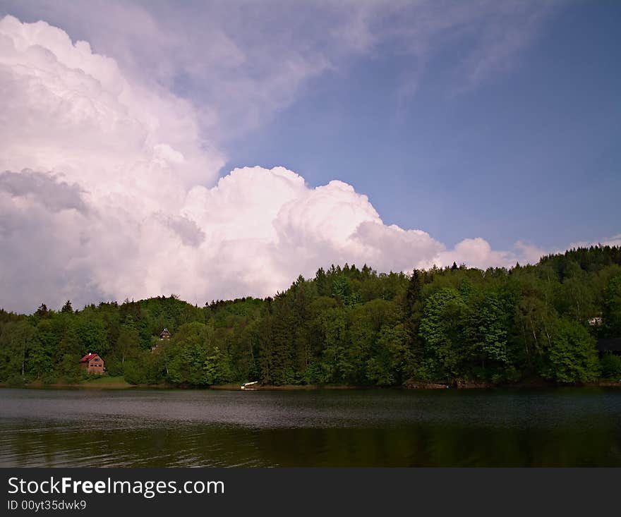 Dramatic sky above lake coast