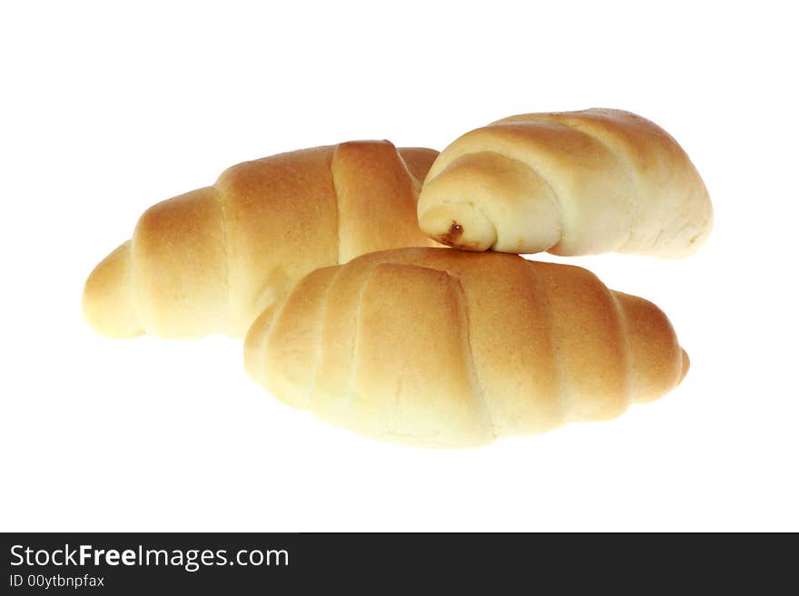 Three croissants isolated on a white background. Three croissants isolated on a white background.