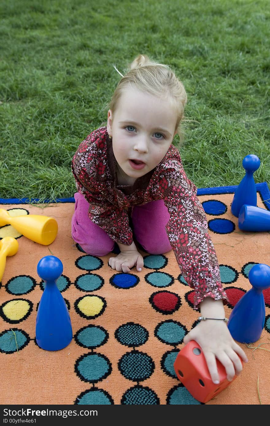 Child Playing With A Board