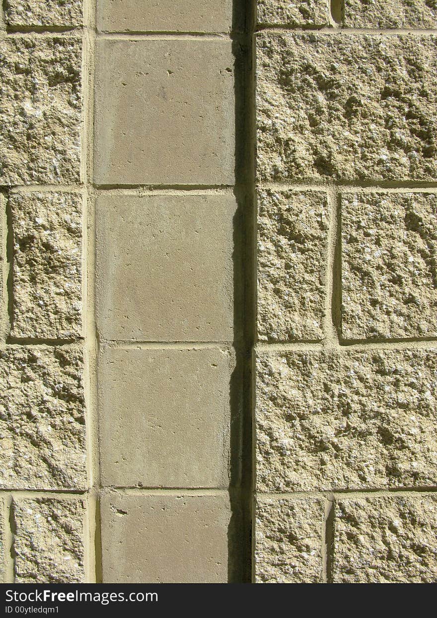 Vertical close-up of concrete block wall with vertical channel. Vertical close-up of concrete block wall with vertical channel