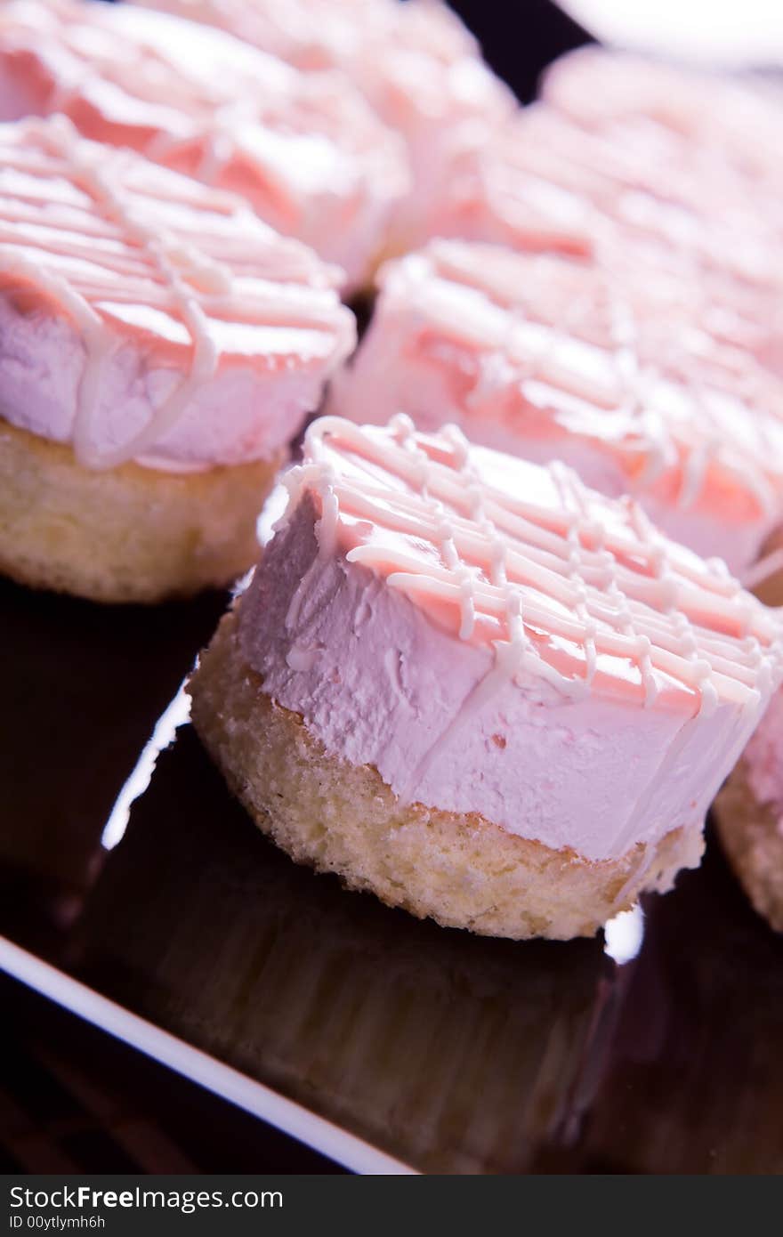 Small cakes on black dish