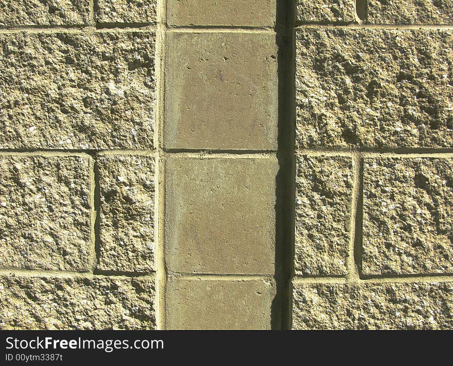 Horizontal close-up image of concrete block wall with vertical channel. Horizontal close-up image of concrete block wall with vertical channel