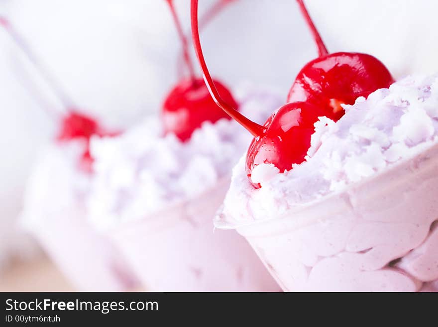 Small cakes with cherry close up