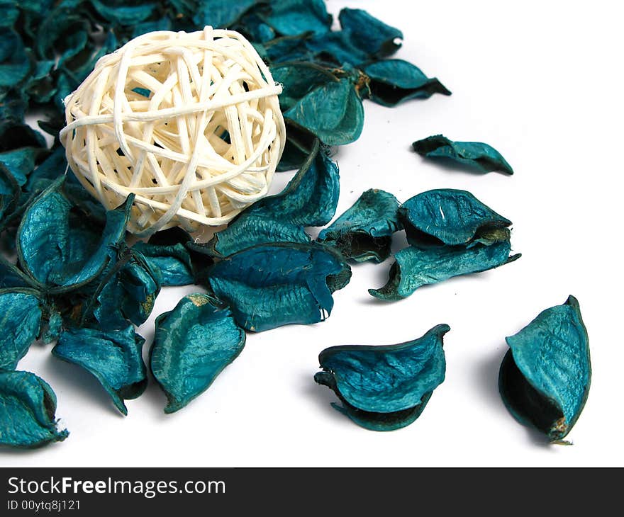 Woven bamboo ball and green Potpourri, on a white background. Woven bamboo ball and green Potpourri, on a white background