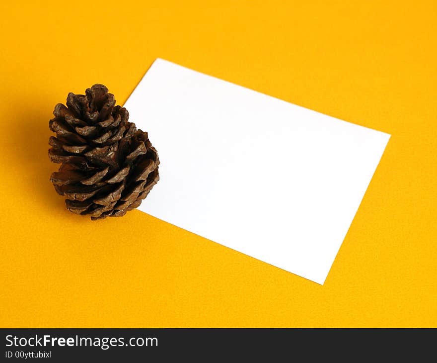 Gift card with a pine cone on a yellow background