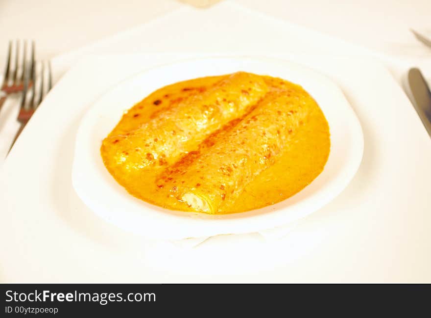 Filled canellonis with cheese and tomato sauce