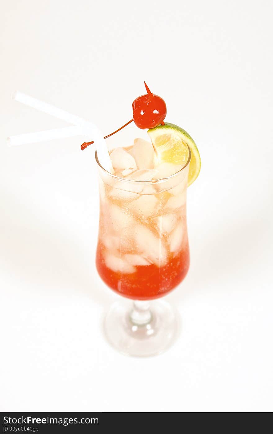 Refreshing red strawberry cocktail served with ice and lemon