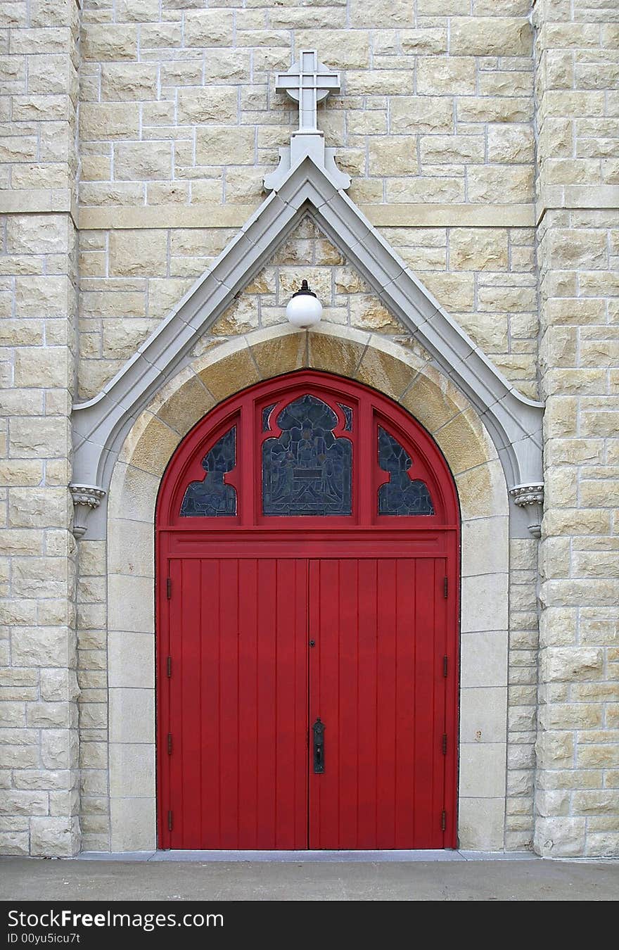 Episcopal church door, red with stained glass above. Episcopal church door, red with stained glass above.