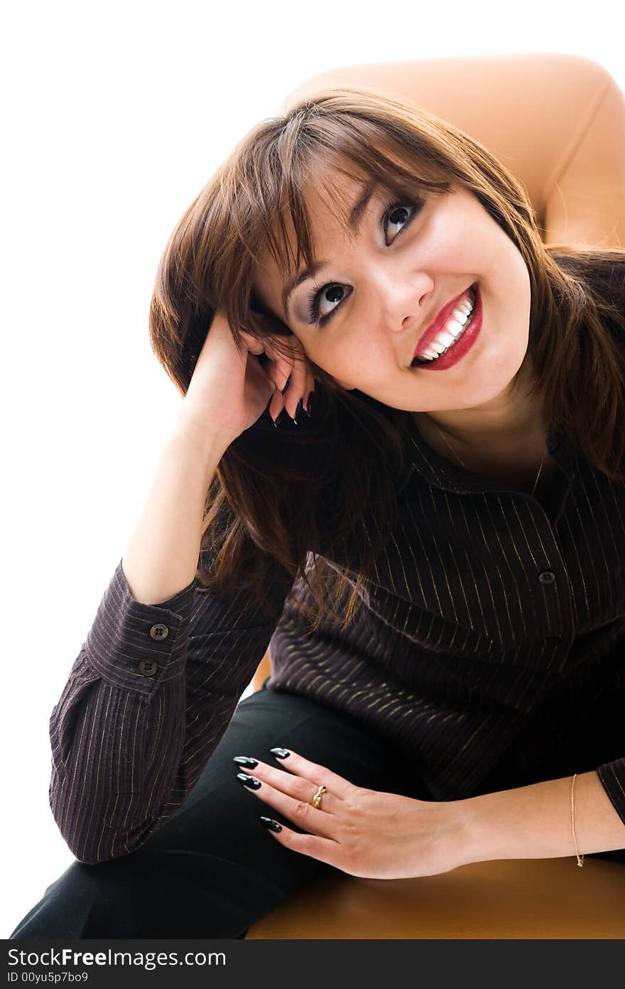 A young japanese woman smile. Sitting in an office armchair. Isolated over white