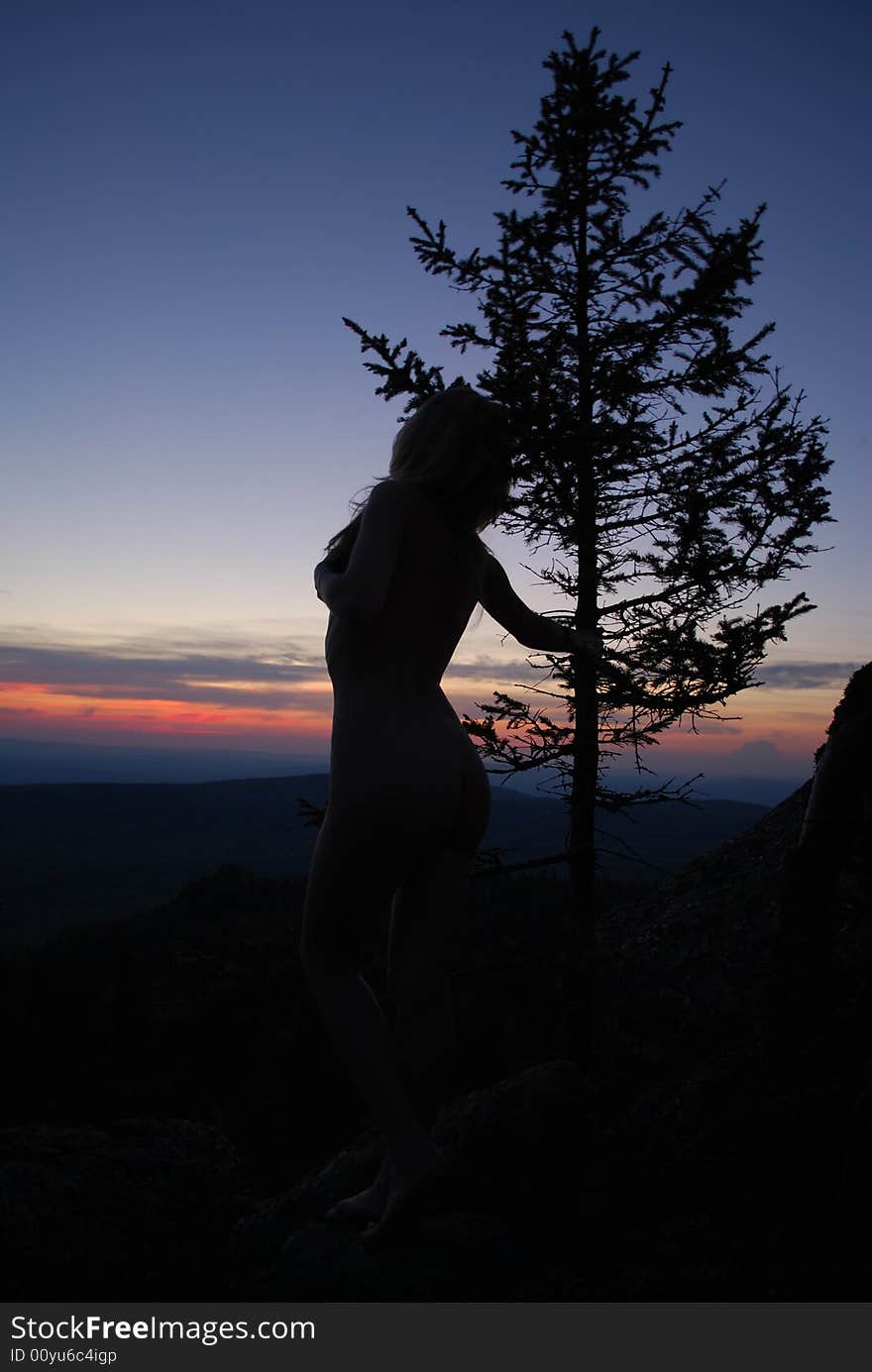 Sundown, tree & sexy woman in mountains