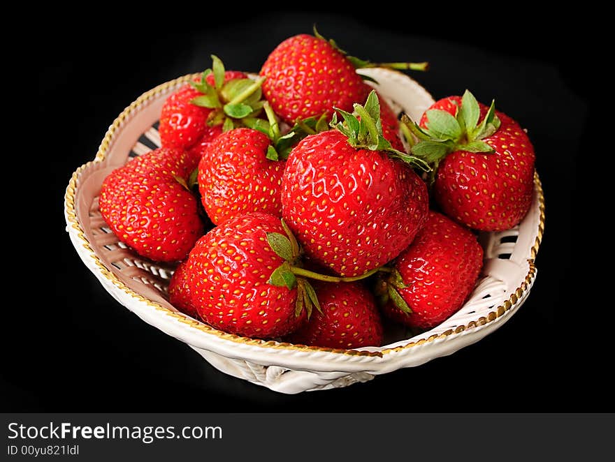 Macro of strawberries against black