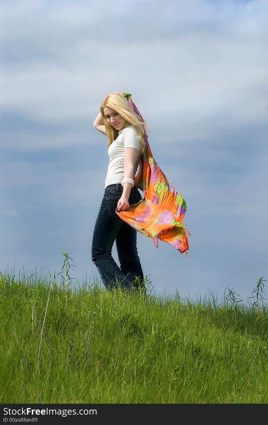 Girl with  scarf stand on a wind. Girl with  scarf stand on a wind