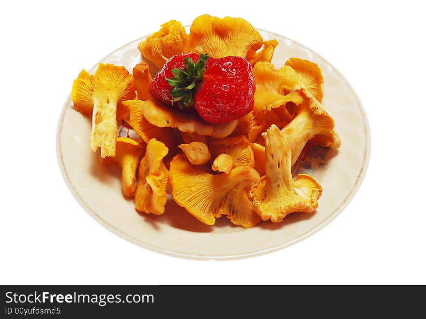 Fresh yelow edible mushroom with strawberry on its