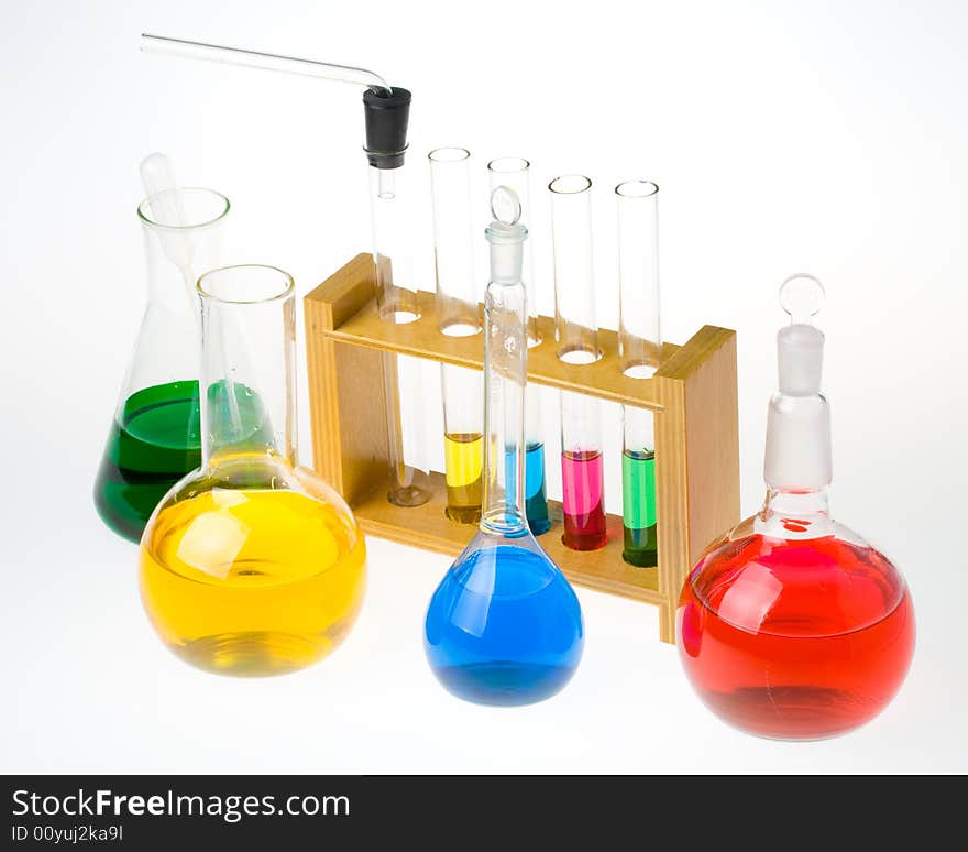 Various colorful glass laboratory ware on a white background. Various colorful glass laboratory ware on a white background