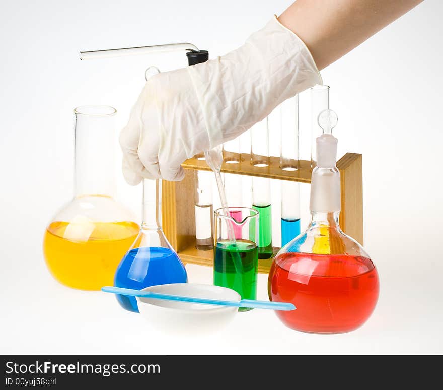 Various colorful glass laboratory ware on a white background. Various colorful glass laboratory ware on a white background