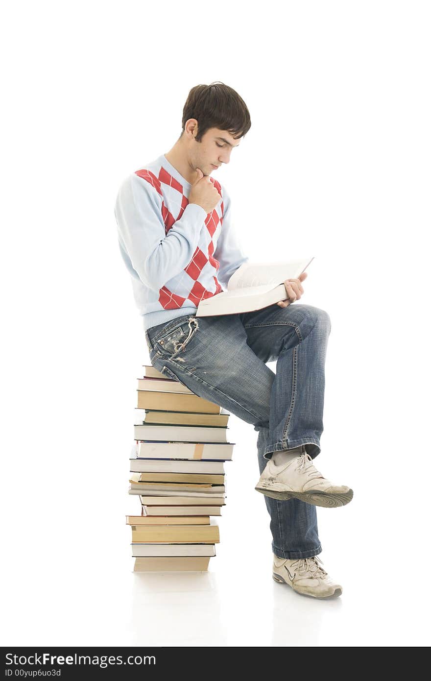 The young student with the books isolated on a white background