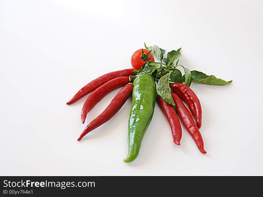 Kitchen vegetable chili-pepper peppers and tomatoes