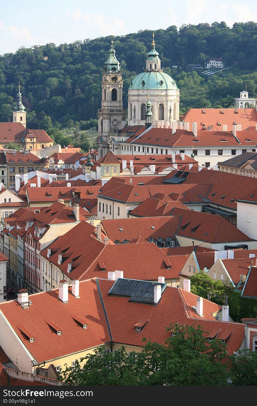 View from Prague castle to baroque St. Nicholas church over Lesser Town. View from Prague castle to baroque St. Nicholas church over Lesser Town.