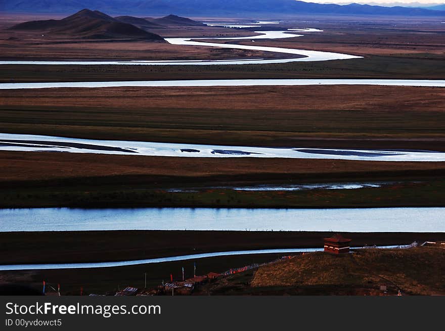 When travelling in Tibet of China in autumn,   headwaters Yellow River on the meadows appear in front of us, in darkness after sunset.