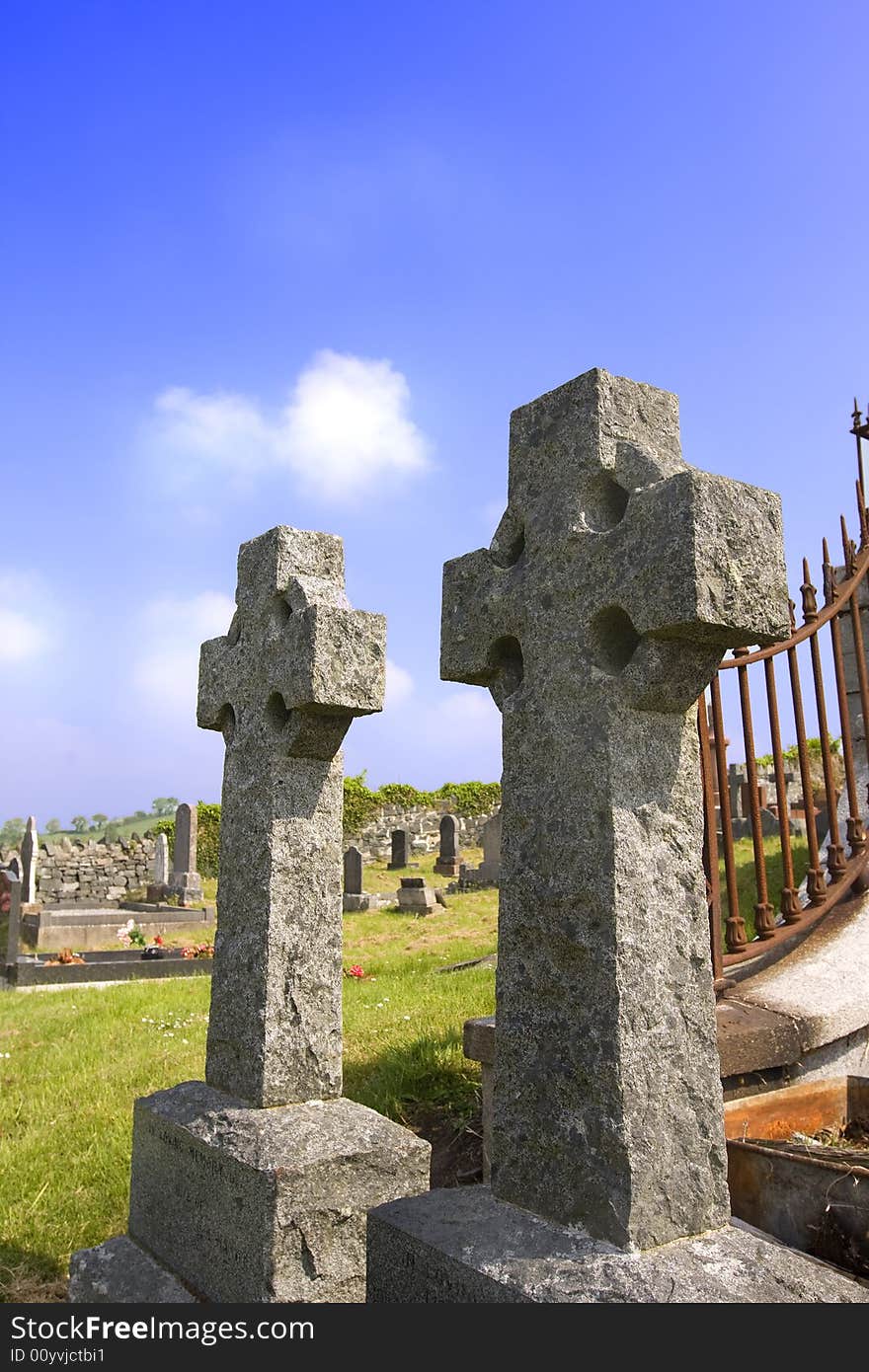 2 irish celtic crosses in an old grave yard. 2 irish celtic crosses in an old grave yard