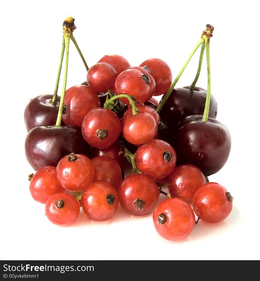 Cherry and currant on a white plate. Cherry and currant on a white plate