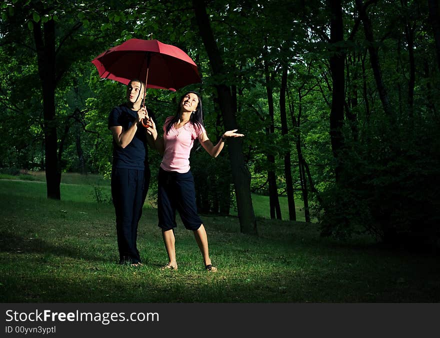 Young Couple Under Umbrella.